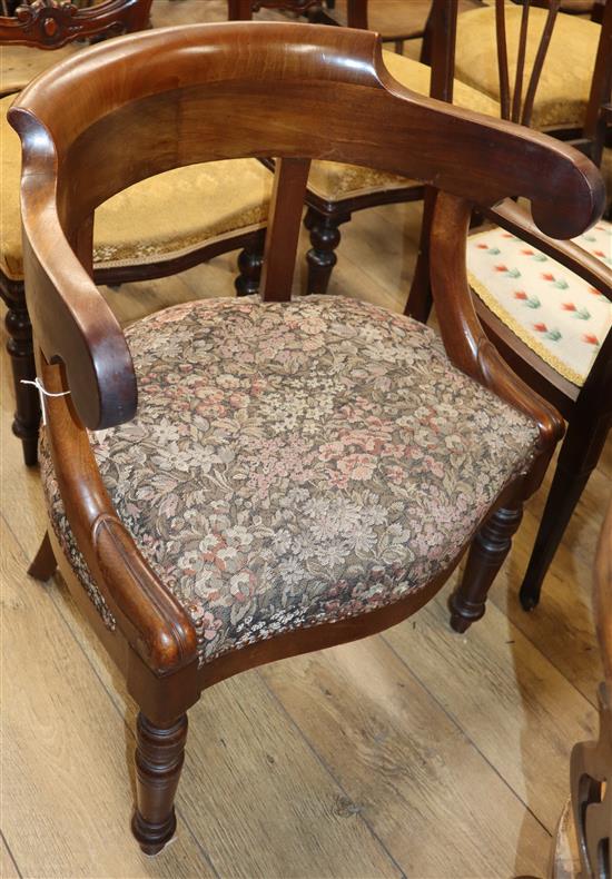 A 19th century mahogany tub-shaped open armchair